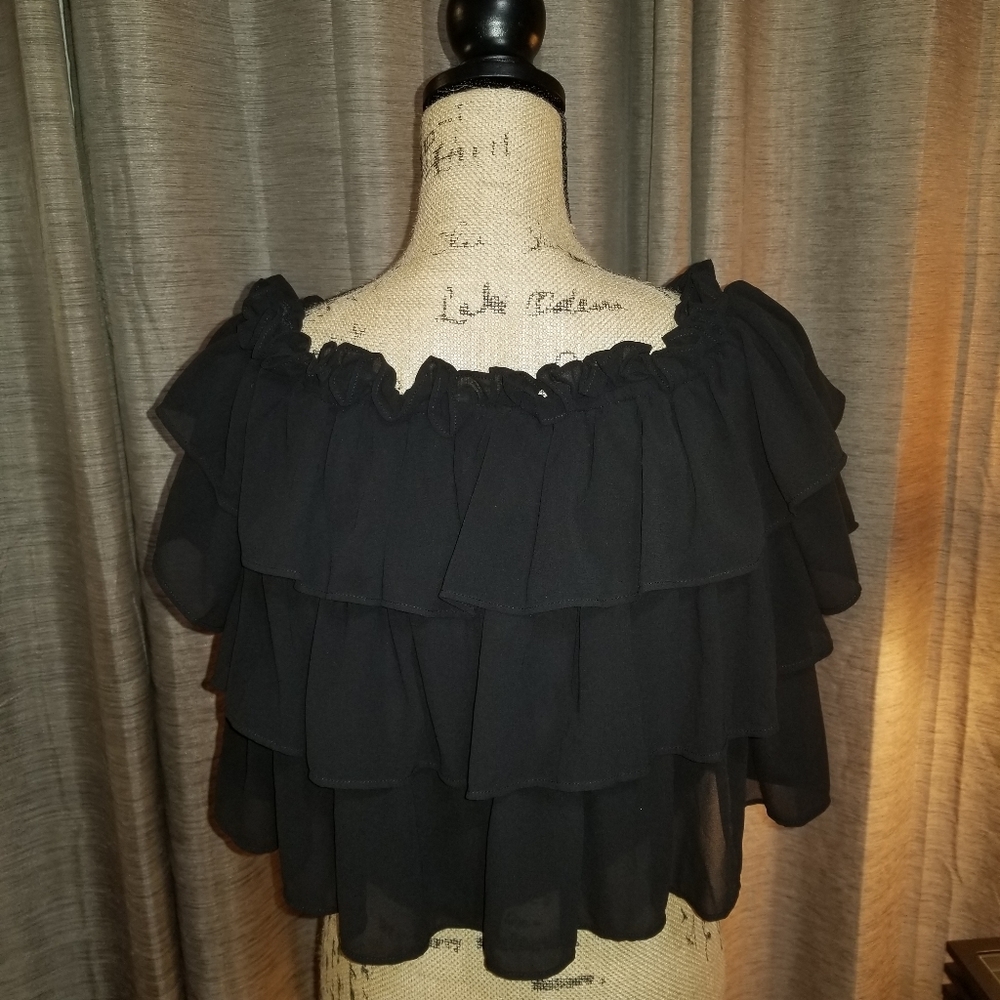 Black top. Multi tiers can be worn on or off the shoulder.  No visable fault